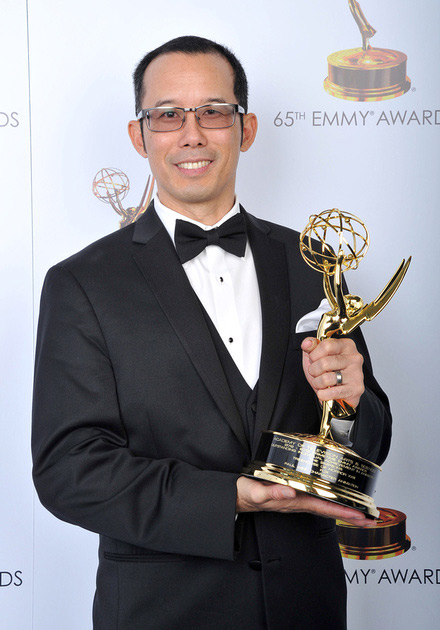 Photo of Paul Wee with his Emmy.